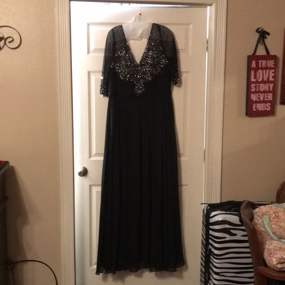 Full length formal gown with elbow-lethal sleeves.